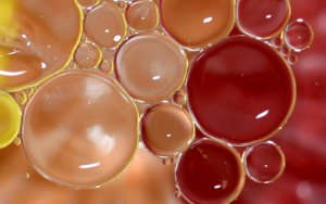 Oil floats in water because of its lower specific gravity.