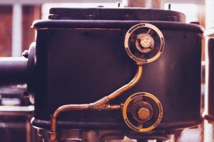 Float Switches for Boilers from SMD Fluid Controls A sepia-tinted photo of and antique boiler.