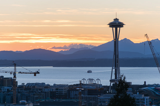 A view of the Puget Sound with the Space Needle in the foreground.